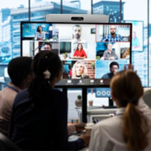 Presenter delivering a hybrid event session with large digital screen and event branding at Velocis conference